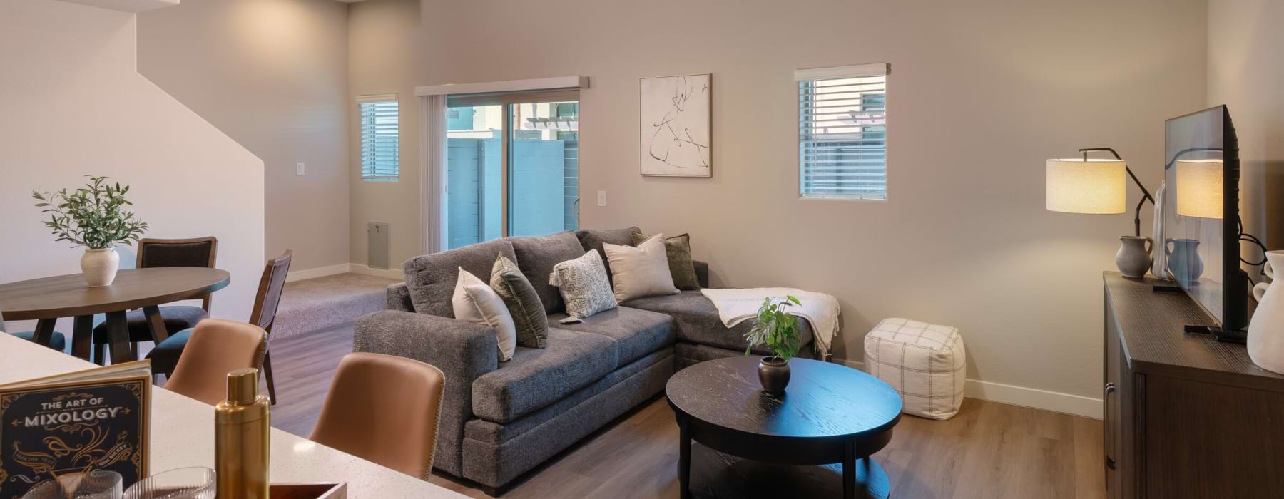 well lit living room/kitchen